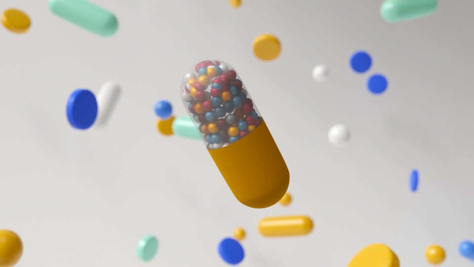 3d render of pills of various shapes and sizes