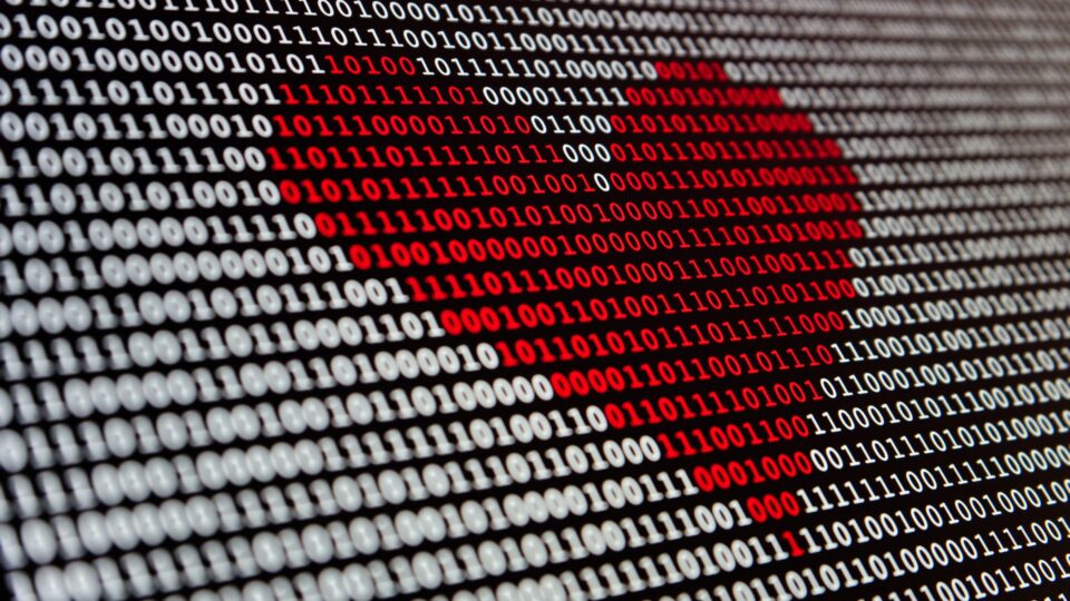 binary code displaying a red heart