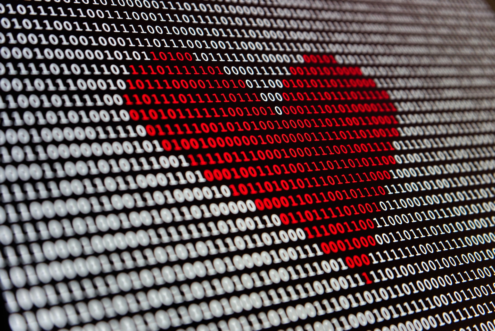 binary code displaying a red heart