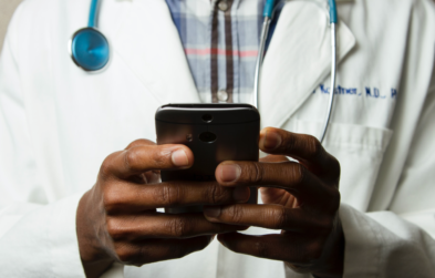 Photo of a doctor holding a smartphone