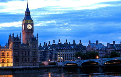 UK Parliament building at dusk.