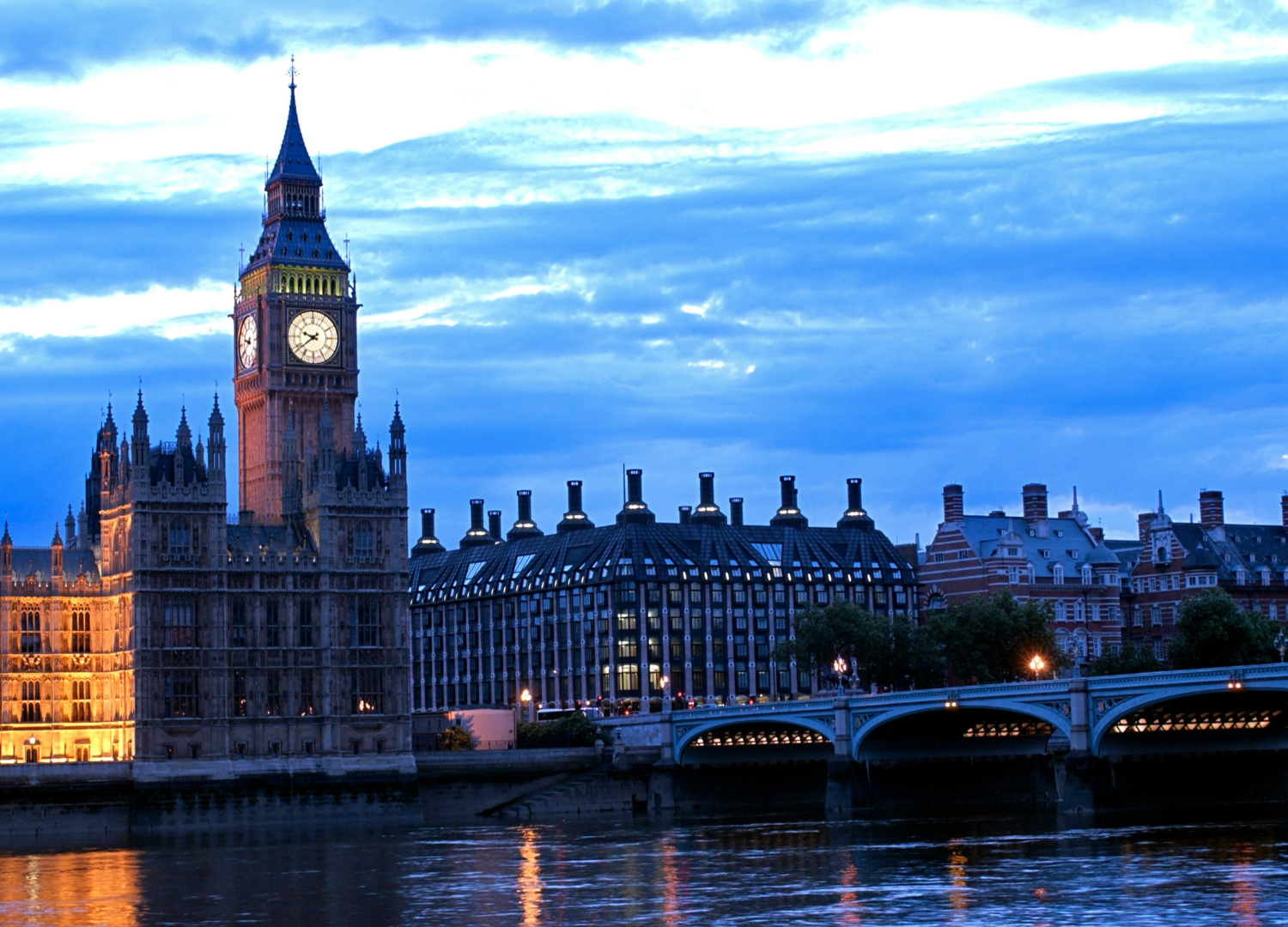 UK Parliament building at dusk.