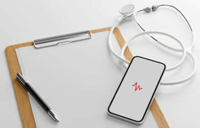 Stock photo of a clipboard, stethoscope, and smartphone displaying a heart rate icon
