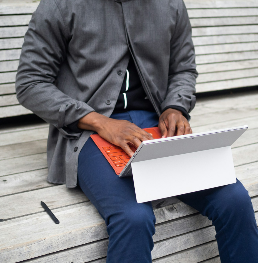 Professional man typing on an orange keyboard