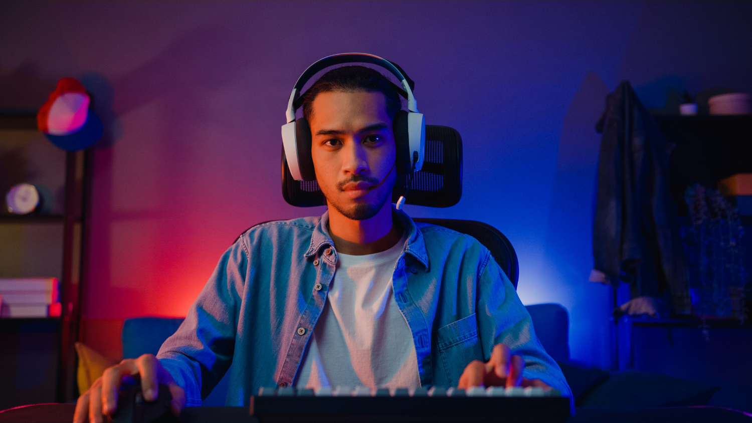 Guy wearing headset playing a computer game