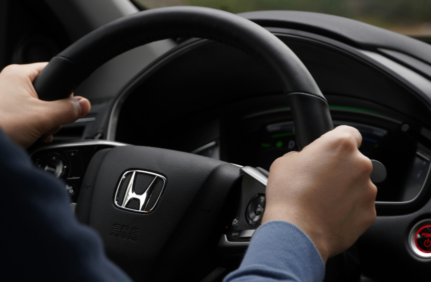 Person driving Honda car.