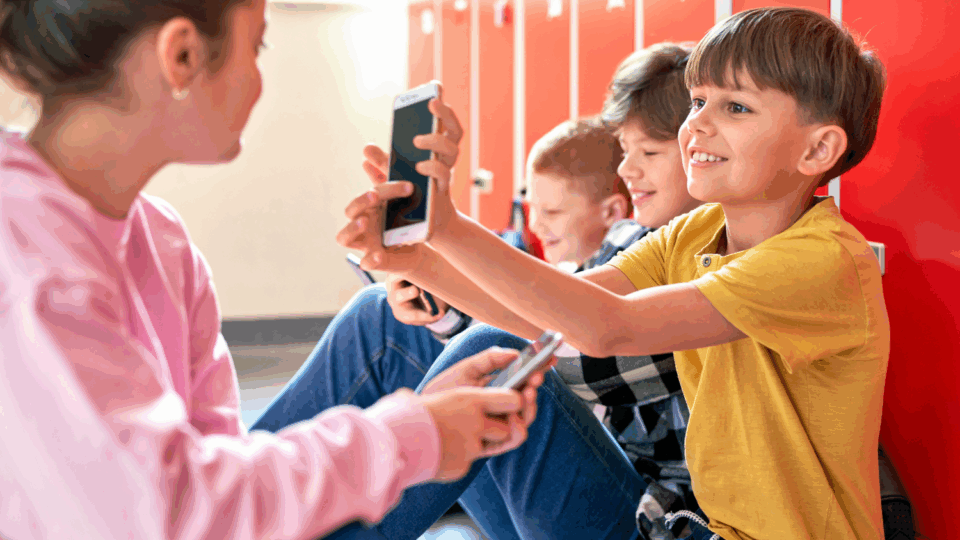 Young kids using cellphones