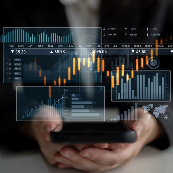 Transparent graphs displayed over a person holding their cell phone.