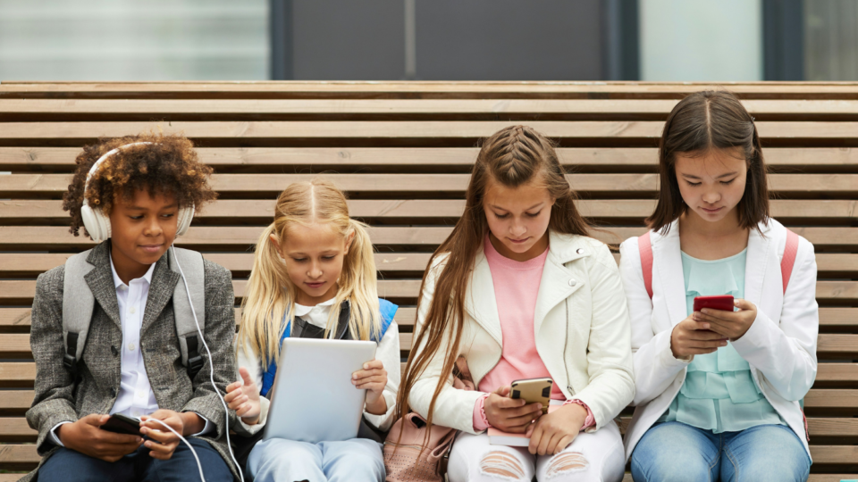 Young children using tech devices